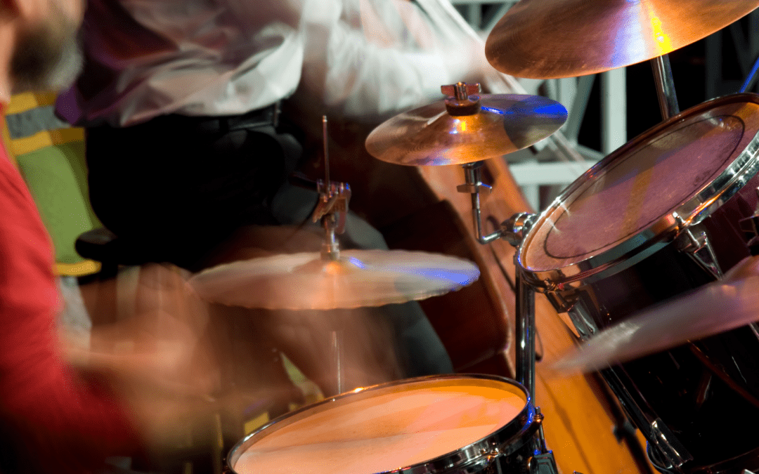 Image of drummer performing live in a venue